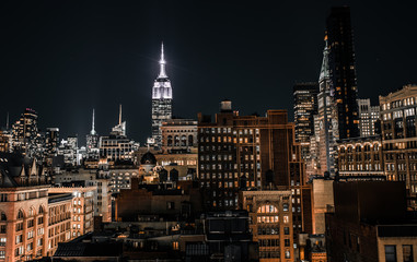 Night time viw of Manhattan skyscrapers with the Empire State Building