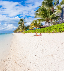 tropical beach with palms and white sand