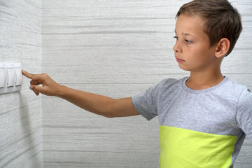 Kid turns off light