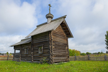 Old wooden chapel of St. Nicholas the Wonderworker closeup on august morning. The village of Gomorovici. Leningrad region, Russia