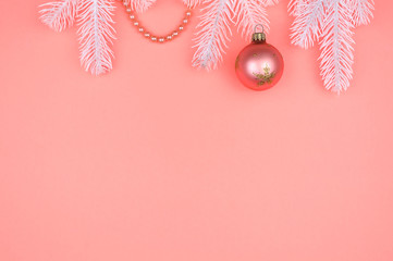 Fototapeta premium White Christmas tree branches, pink ball and pearls.