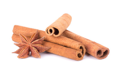 Spicy Cinnamon Sticks and Anise isolated on White background closeup macro shot