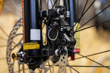 Close up photo of front hydraulic brake calliper and rotor. 