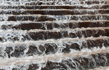 steps of a big stairway with water