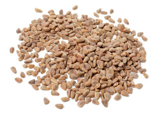 Pile of pine nuts on white background