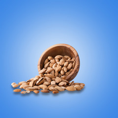 Fresh almonds isolated on light blue background