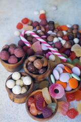 colorful bright assorted sweets and candy for kids party on white table