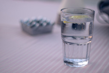 water with lemon fresh isolated pink tablecloth