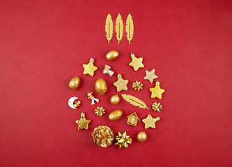 Christmas decoration with xmas golden ornaments with copy space over the red background