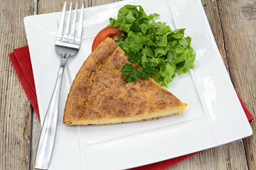pieces of cheese quiche on a plate