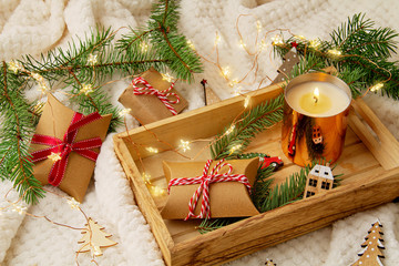 Top view over Christmas composition with gifts, xmas tree, candle