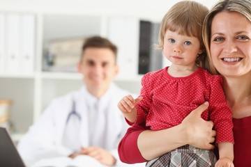 Little child with mother at pediatrician reception