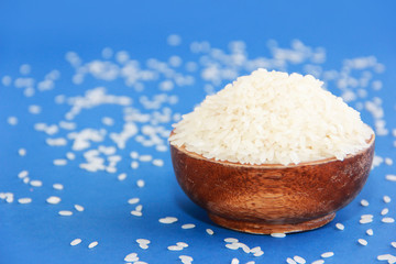 natural fresh white round rice in a decorative wooden plate