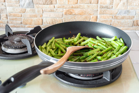 Home Cooked Food. French Green Beans, Dried Chillies And Garlic In Stir-fry Pan On Cooking Stove