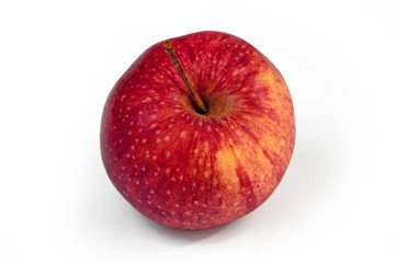 Single natural unwaxed organic red and slightly yellow apple on white background