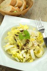 endive salad with balsamic vinegar on a plate