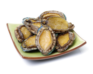 Raw abalones on the white background 