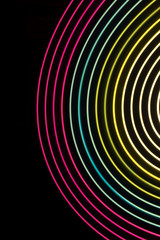 Multicolor light circles on a black background.