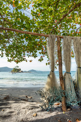 Tree fishing net on Castelhanos Ilhabela beach where is a secluded fishing village on the tropical coast of Sao Paulo in Brazil
