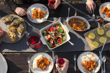 Healthy family  food lunch, top view.  dinner table, people eat healthy food. Salad, rice, tart cake, vegetables on a wooden background.