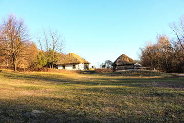 Fototapeta premium Open Air Museum Pirogovo. Old wooden farm house in the Ukrainian countryside 