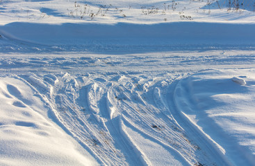 Traces of a car in the snow