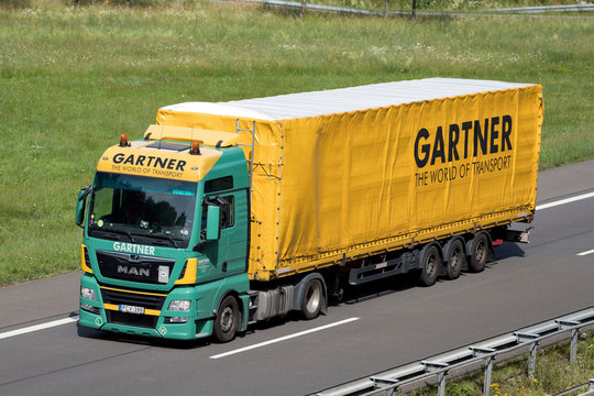 WIEHL, GERMANY - JUNE 25, 2019: Gartner MAN TGX truck with tarpaulin trailer on motorway.
