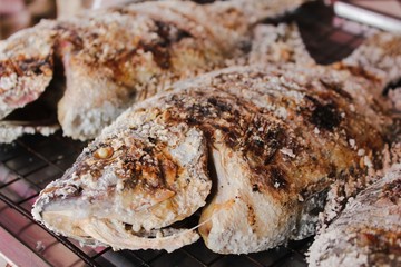 Grilled fresh fish with salt on charcoal