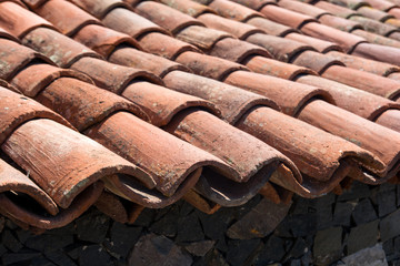 Old roof tile. Side view of the roof tile.