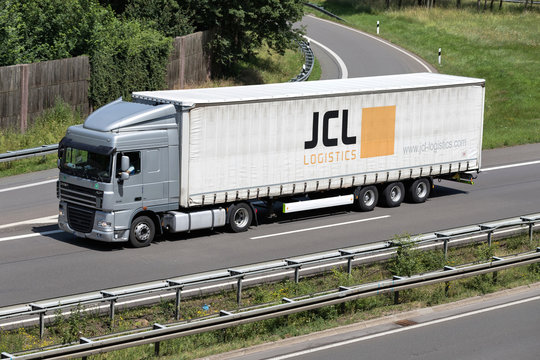 WIEHL, GERMANY - JUNE 24, 2019: JCL Logistics DAF XF truck with curtainside trailer on motorway.