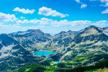 Naklejka na ściany i meble Mountain tops marvelous panorama, calm and beautiful sky, lake. Alpine scenery landscape, rocky hills.