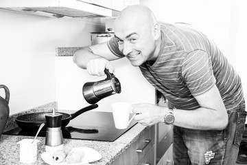 ordinary man preparing coffee in moka pot in the kitchen