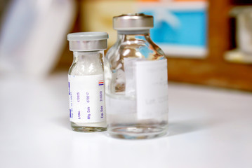 Closeup and crop Sample Injection and medicine bottles on blurry background.