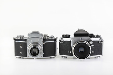 The old 35 mm SLR film cameras on a white background.