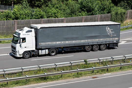 WIEHL, GERMANY - JUNE 24, 2019: TGW Volvo FH truck with curtainside trailer on motorway.