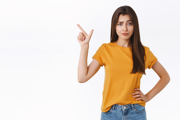 Skeptical arrogant and displeased young woman find new product suspicious and unworthy her...