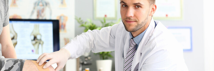 Serious traumatologist at workplace