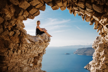 View from Monolithos, landscape at the island Rhodes, Greece. Girl admires the beauty of the landscape