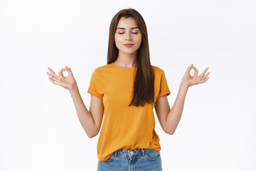 Calm, relaxed good-looking brunette girl release stress, close eyes and smiling peacefully...