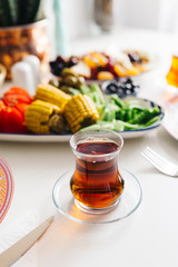 Traditional a glass of Turkish Tea and breakfast