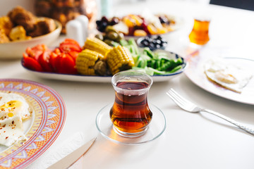 Traditional a glass of Turkish Tea and breakfast