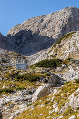 Bivouac shelter below Dolkova špica in autumn