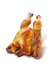 Whole roasted chicken against white background