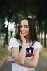 Young pretty girl walking down the street
