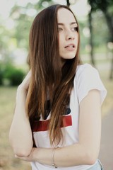 Young pretty girl walking down the street