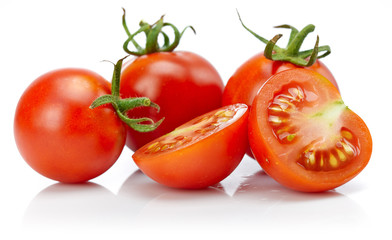 Tomato in cut with leaf for packaging and label. Still life harvest vegetable. Healthy food organic foodstuff. Isolated on white background.