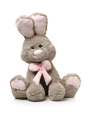 Old rabbit toy isolated on wood background