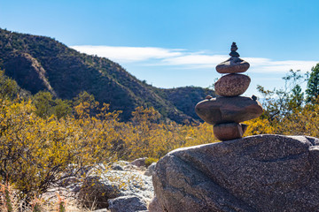 Stones placed in pile in a mountainous landscape. Artistic way of placing rocks in a landscape.