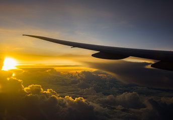 Fototapeta na wymiar airplane wing sunrise