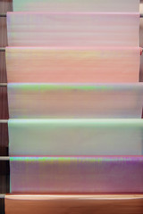Modern packaging materials for florists. Delicate pink mother-of-pearl tone material. Multicolored...